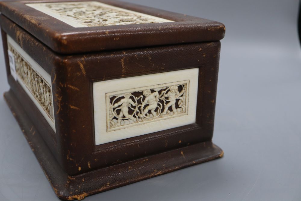A neo-classical style ivory mounted leather casket, length 31cm